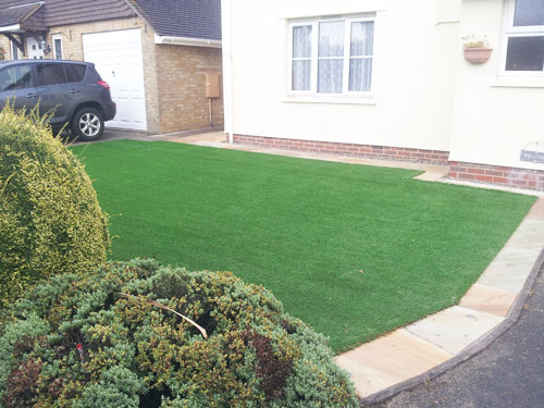 An artificial lawn before Willow Landscapes work