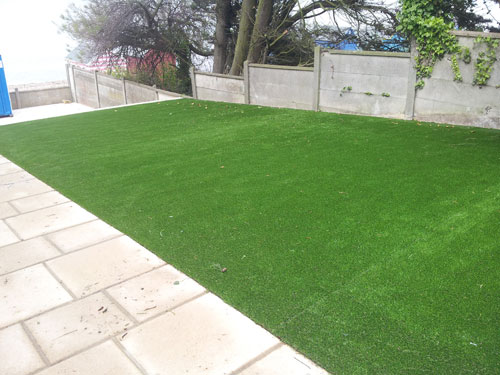 An artificial lawn before Willow Landscapes work