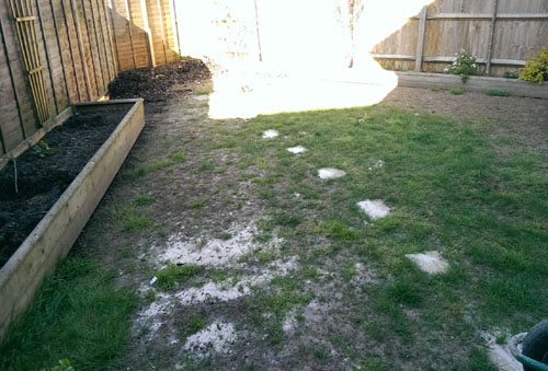 An artificial lawn before Willow Landscapes work