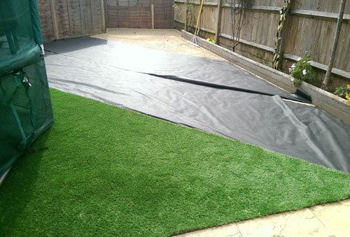 An artificial lawn before Willow Landscapes work