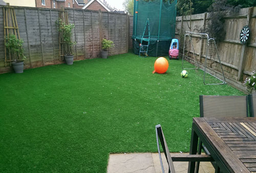 An artificial lawn before Willow Landscapes work